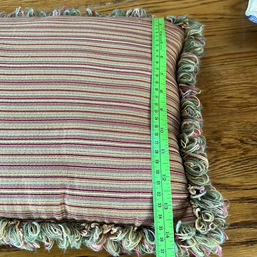 Striped gold/wine accent pillow with fringe.  Size is 14” x 18”